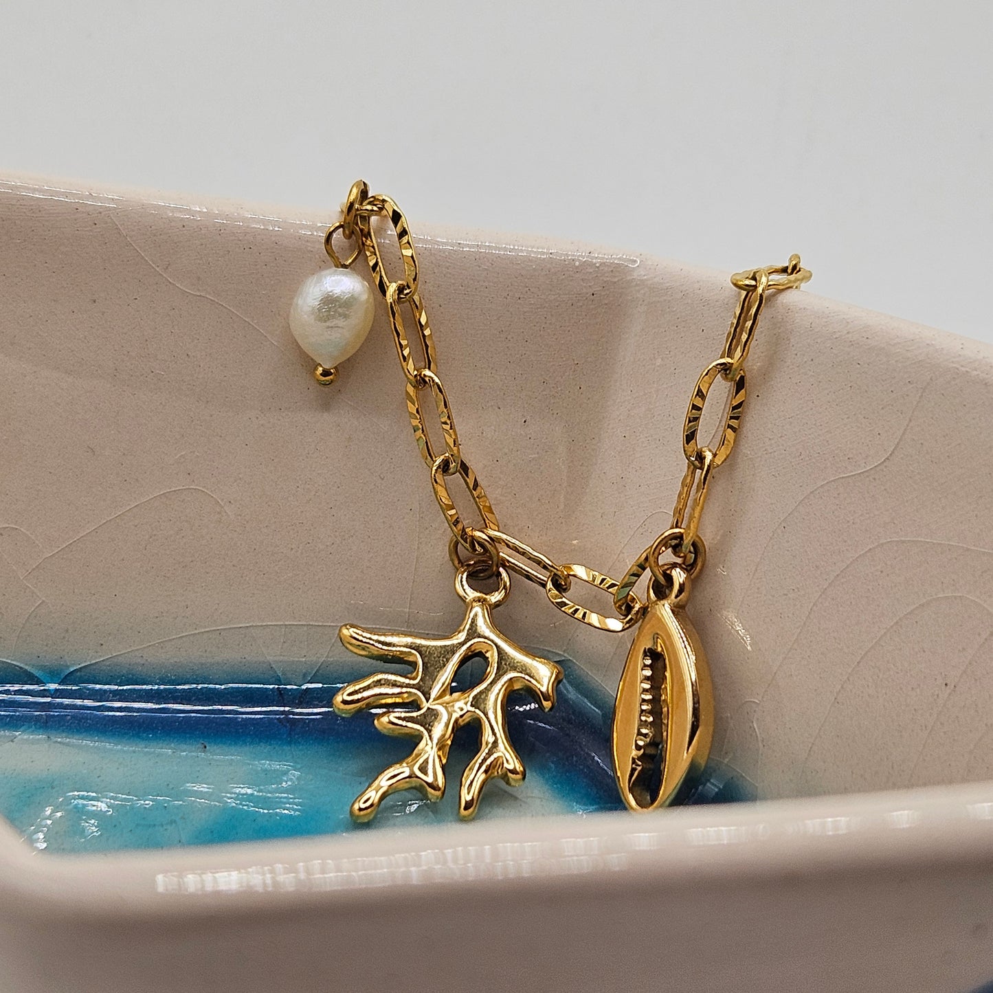 Calypso - Ensemble en acier Inoxydable doré (Collier, Boucles d'oreilles, Bracelet et Bague)